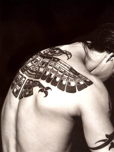 His famous back tattoo that stretches across his entire back was done in the